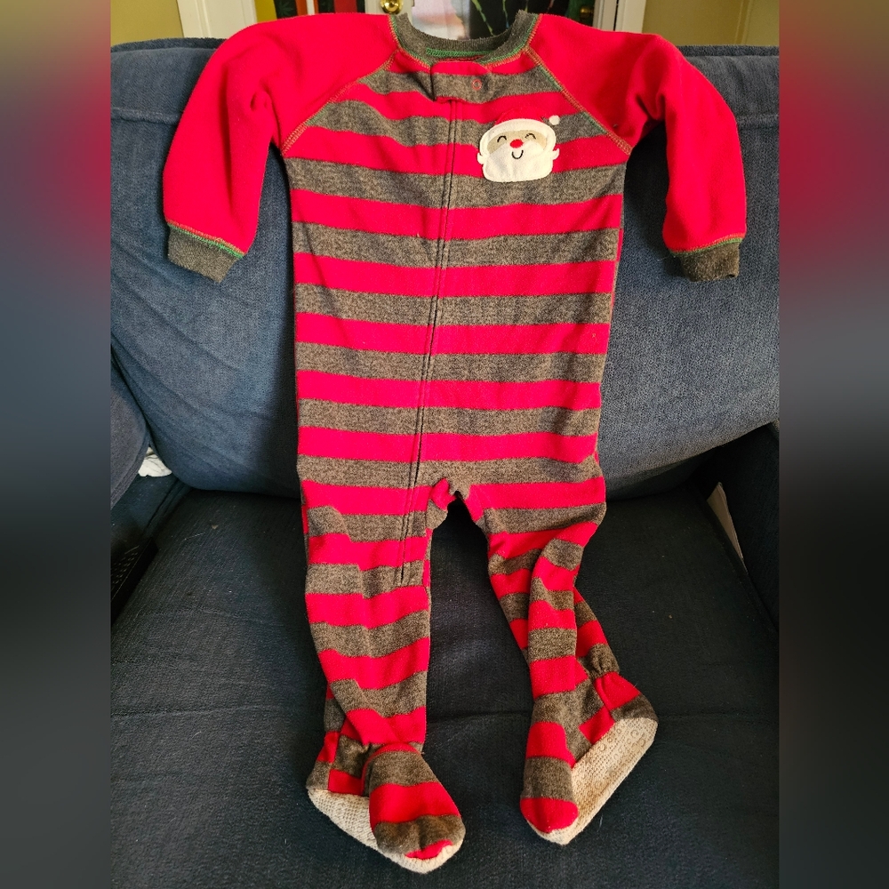 Boys footies that is striped red and gray with Santa on the front